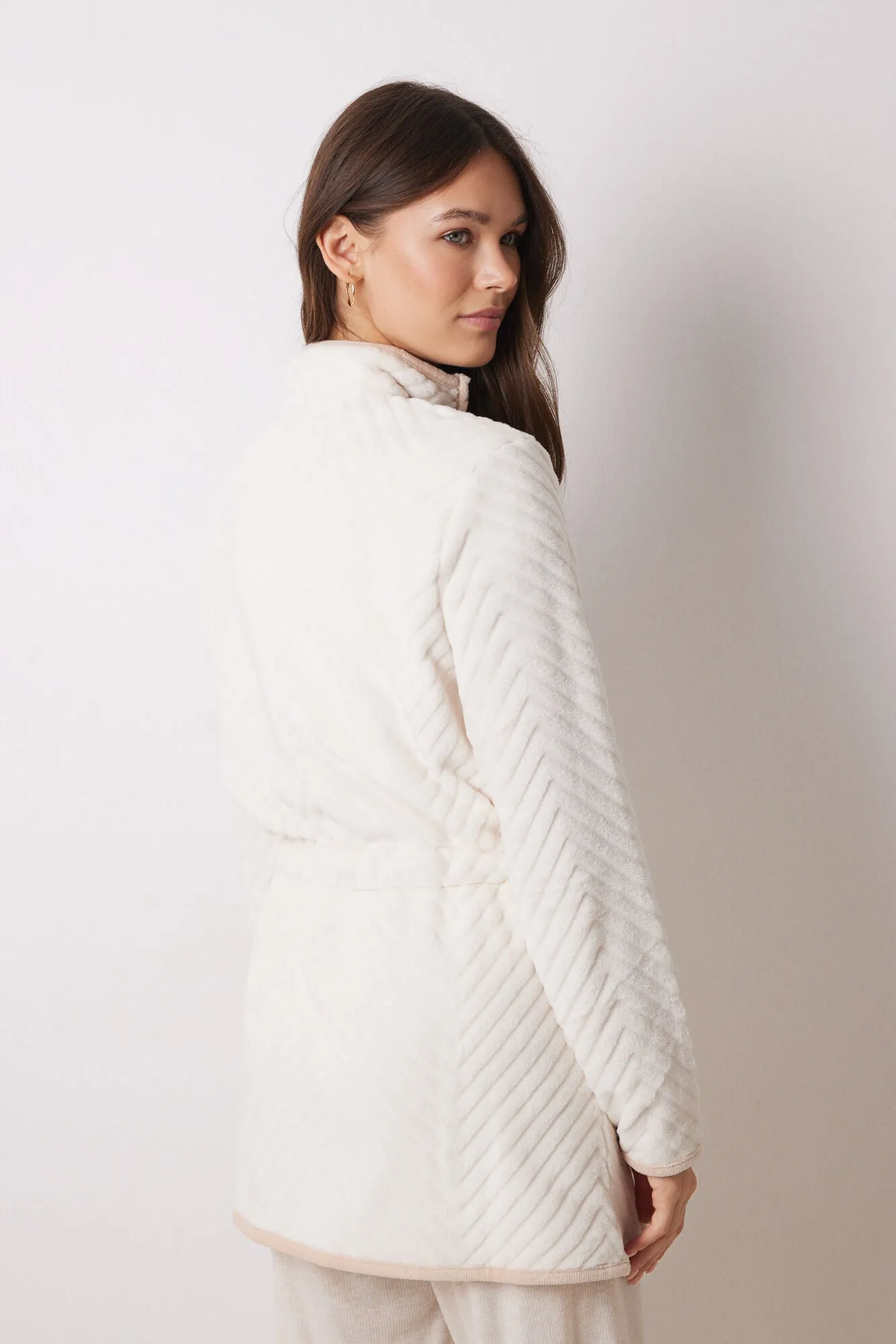 Long fluffy beige zip fastening
