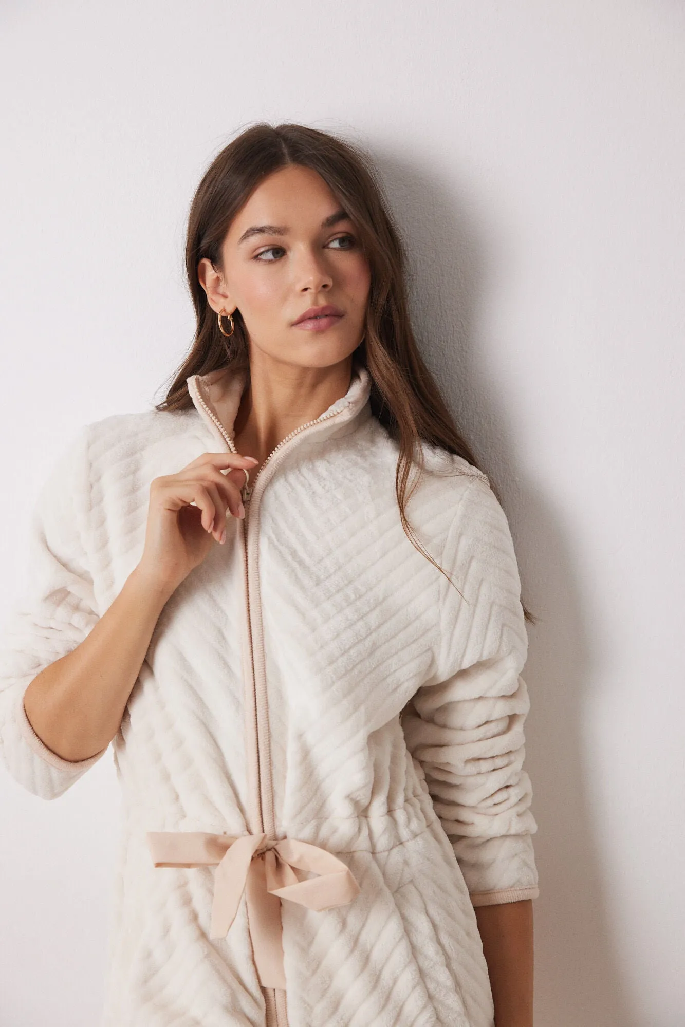 Long fluffy beige zip fastening