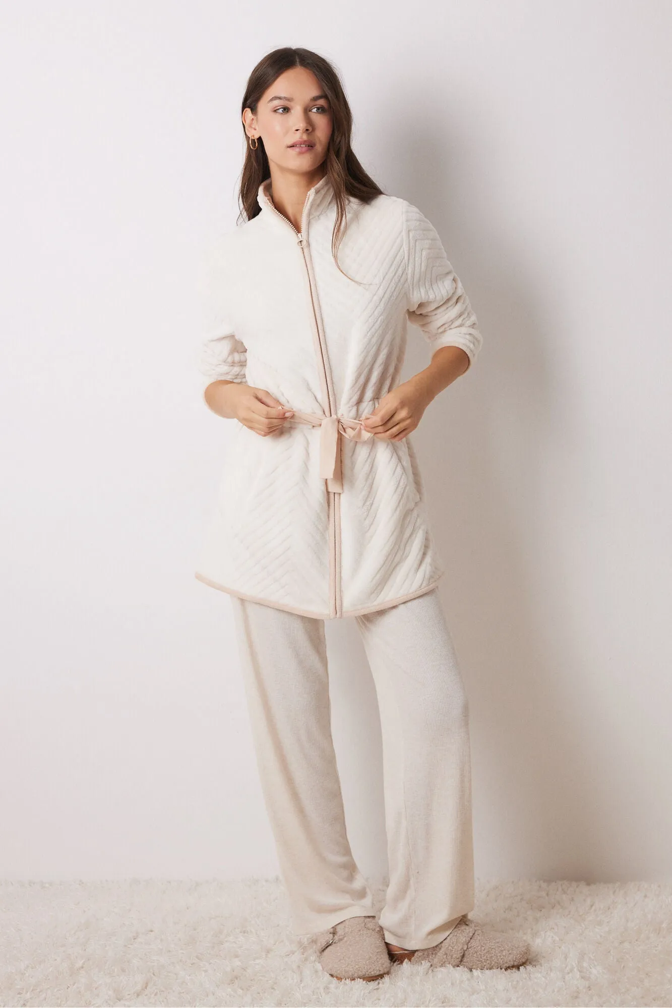Long fluffy beige zip fastening